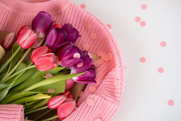 Pink tulips on white background, top view, flat lay with copy space. Spring, flowers concept.
