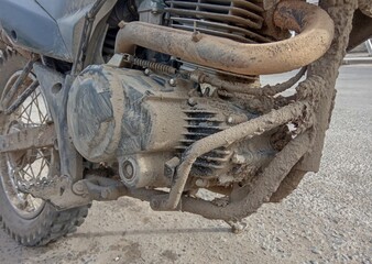 motorcycle engine in the mud after motocross