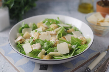 A bowl with classic Caesar salad	