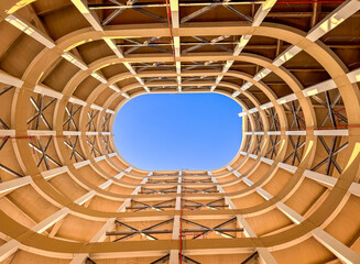 Architectural Symmetry: Circular Parking Structure with Open Sky