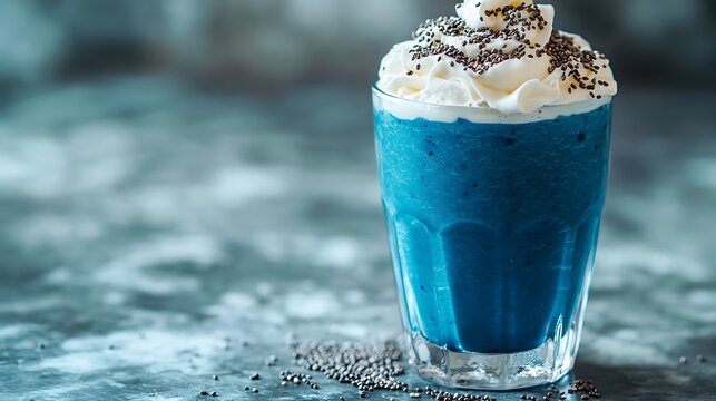 A dreamy blue spirulina smoothie in a modern glass, topped with whipped coconut cream and chia seeds, soft reflections on a glossy countertop, clean and airy setting, perfect stock photo aesthetic,