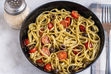 linquine with pesto, tomatoes and olives