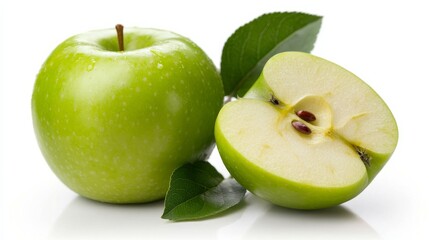 Fresh green apple with a sliced half and leaves on a white background