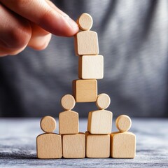 Creative Teamwork Concept with Wooden Figurines Stacked on Top of Each Other Representing Collaboration and Success in Business Settings