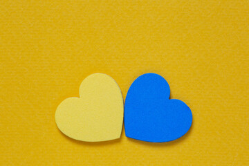yellow and blue hearts on orange cardboard