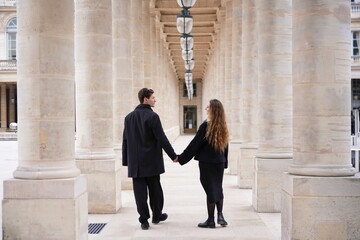 Romantic Couple Holding Hands at Palais-Royal in Paris, France 