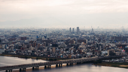 Fototapeta premium Osaka panorama, aerial cityscape with Yodo Seta River embankment and skyscrapers, Osaka prefecture, Japan, Umeda business district, streets of Osaka downtown center, seen from observation deck