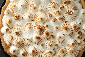 Delicious meringue pie as background, top view