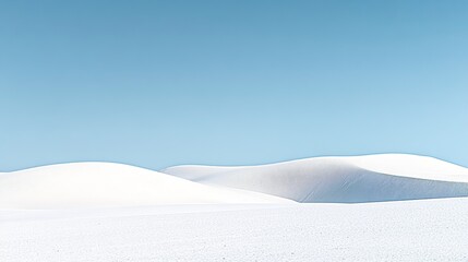 Expansive Rolling Sand Dunes Under a Clear Sky