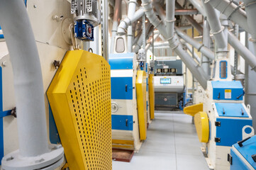 Roller deck machines for husking buckwheat grain, operating in a modern processing facility.