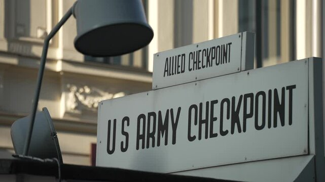 US Army Checkpoint sign at Checkpoint Charlie on a sunny day, Friedrichstrasse, Berlin, Germany