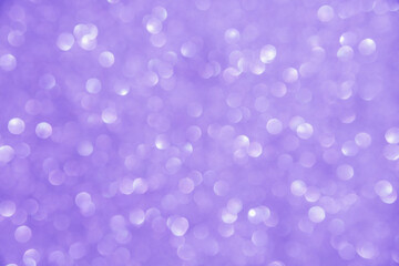 A soft lilac bokeh-style background with unfocused light creates an elegant space for text or design elements.