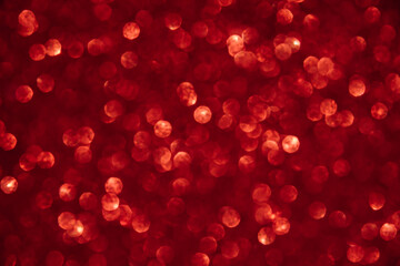 A bright red bokeh-style background with defocused light creates an elegant space for text or design elements.