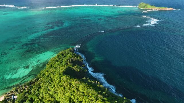 Aerial view of tropical island with beautiful coral reef and clear turquoise ocean, Satitoa, Atua, Samoa.