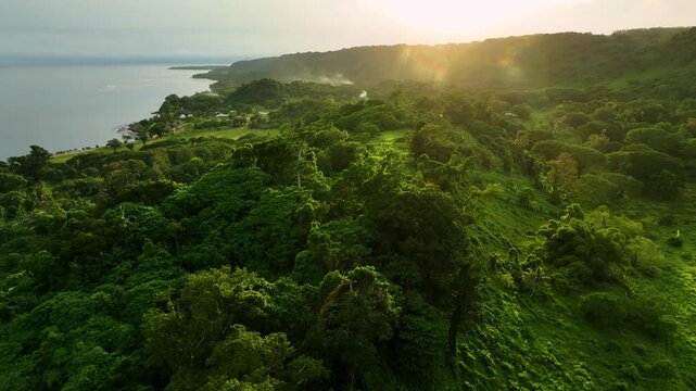 Aerial view of a breathtaking sunset over a serene mountain and ocean landscape, Port Vila, Shefa, Vanuatu.