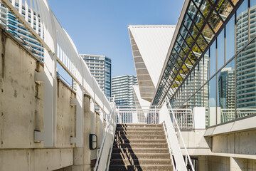 Fototapeta premium Yokohama cityscape: stairs leading to modern architecture.