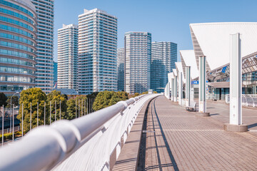 Yokohama cityscape, modern buildings, walkway, and station