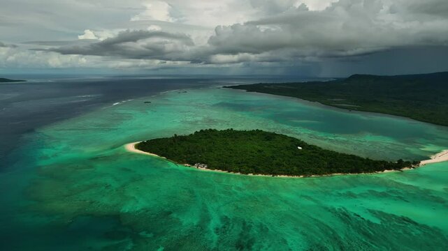 Aerial view of beautiful tropical beach with clear water, palm trees, and waves, Port Vila, Shefa, Vanuatu.