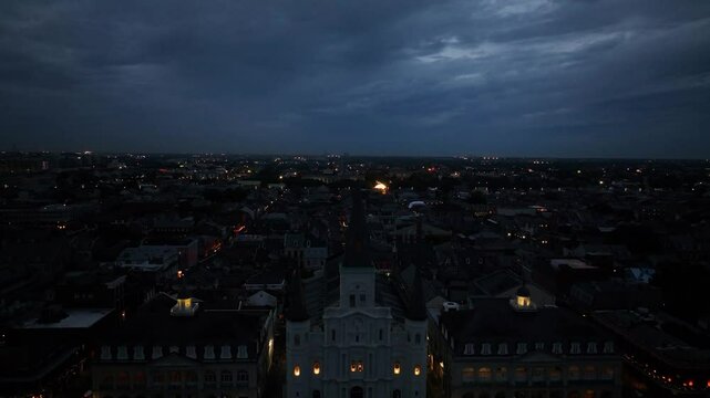 Aerial view of jackson square, cabildo, and presbytere illuminated by city lights at night, French Quarter, Louisiana, United States.