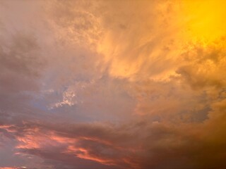 Beautiful sky with natural gradations. Thick clouds in the dusk sky on a winter night. Image of a cloudy sky in the afternoon. View of the night sky with golden light from the evening sun	