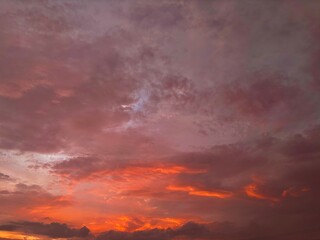 Beautiful sky with natural gradations. Thick clouds in the dusk sky on a winter night. Image of a cloudy sky in the afternoon. View of the night sky with golden light from the evening sun	