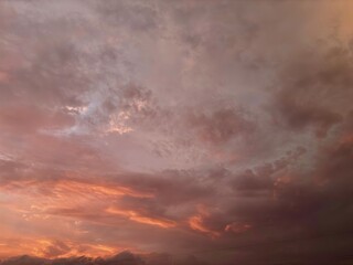 Beautiful sky with natural gradations. Thick clouds in the dusk sky on a winter night. Image of a cloudy sky in the afternoon. View of the night sky with golden light from the evening sun	