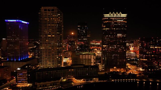 Tampa, United States - 01 February 2025: Aerial view of downtown tampa skyline featuring the regions building and rivergate tower illuminated at night, Tampa, Florida, United States.
