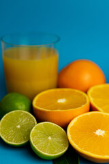 View from above. Cut oranges on a blue background close-up. Vitamin C