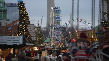People and ferris wheel on Gendarmenmarkt at Christmas in daytime, Mitte, Berlin, Germany
