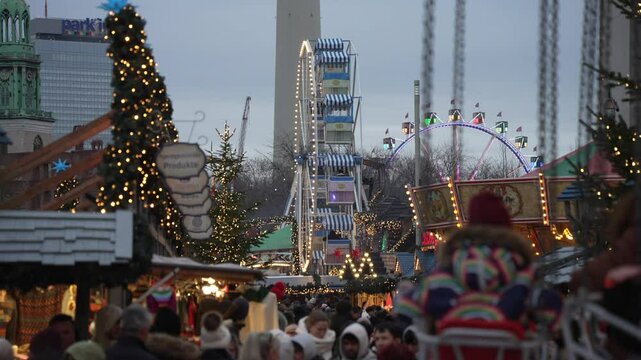 People and ferris wheel on Gendarmenmarkt at Christmas in daytime, Mitte, Berlin, Germany