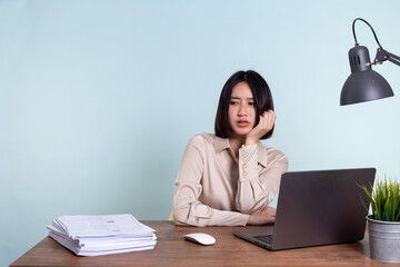 Tired, exhausted Asian woman with a laptop, problems with the project, feeling depressed, laziness...