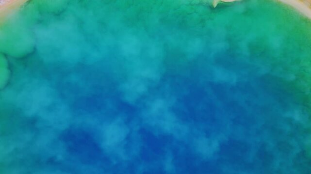 Aerial view of grand prismatic spring with mist and vibrant colors, Yellowstone National, Wyoming, United States.