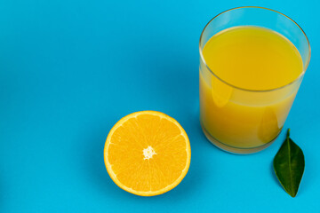 Glass of orange juice view from above.Half an orange and glass of juice close-up