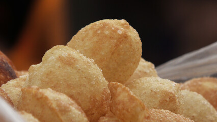 Crispy Indian snack 'Pani puri' displayed in a street food shop