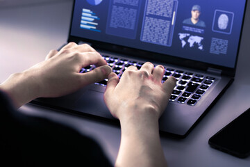 Police investigating with computer in the office. FBI or CIA. Digital research of evidence....