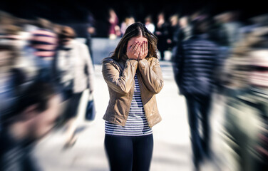 Stress, anxiety, fear or panic attack in public. Woman with mental health disorder. Phobia of crowd of people. Schizophrenia, agoraphobia or paranoia. Busy city street. Depressed introvert person.