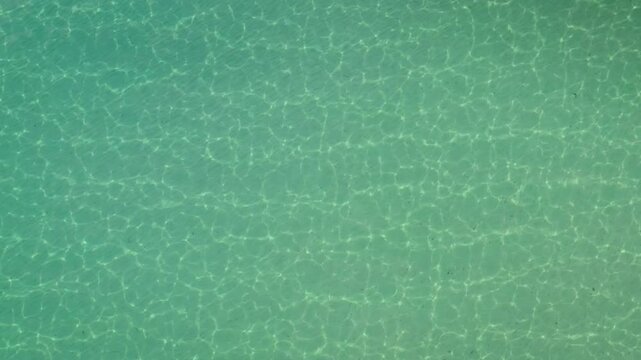 Aerial view of spiaggia su giudeu with turquoise sea and calm waves, Domus de Maria, Sardinia, Italy.