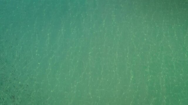 Aerial view of Spiaggia Su Giudeu with turquoise sea and calm waves, Domus de Maria, Sardinia, Italy.