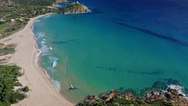 Aerial view of beautiful Spiaggia di Monte Cogoni with pristine sand and tranquil blue water, Domus de Maria, Sardinia, Italy.