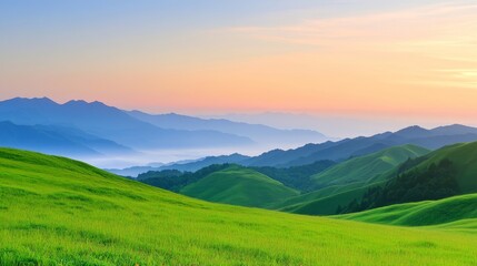 Obraz premium Serene landscape at dawn with rolling green hills and distant mountains under a colorful sky