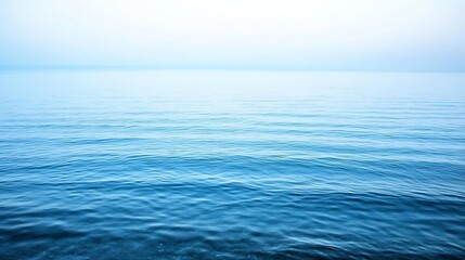 Obraz premium Expansive Calm Ocean Horizon Reflecting Soft Light During Sunrise or Sunset : Generative AI