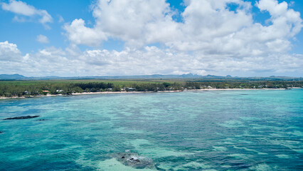 Aerial view of hidden gem — wild tropical paradise with coral reef, coconut trees and other vegetation, white sand beach, Mauritius island, Africa	