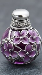 Exquisite purple perfume bottle adorned with silver floral accents against a textured gray backdrop studio shot