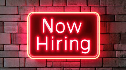 Bright Neon Sign Indicating Job Openings with Brick Wall Background