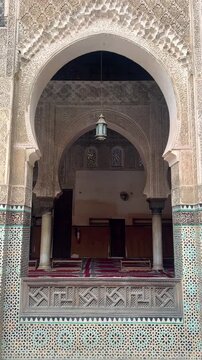 Fes, Morocco - 12 November 2024: beautiful interiors of Medersa Bou Inania. Vertical