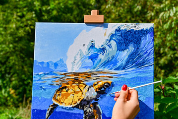 A vibrant painting displayed outdoors, placed on an easel amidst a beautiful natural landscape, showcasing the fusion of art and nature.