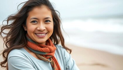 A Radiant Young Woman Smiles Warmly At The Beach, Her Windblown Hair And Orange Scarf Adding To Her Carefree Joy, Bathed In Soft Natural Light