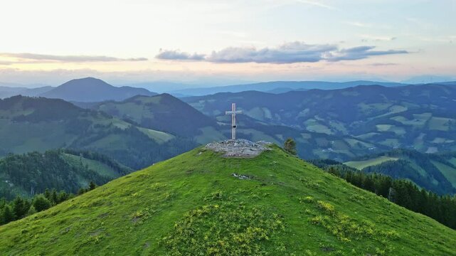 Aerial view of serene mountain landscape with lush pastures and high hills, Sommeralm, Styria, Austria.