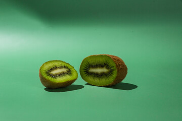 ripe kiwi on a green background