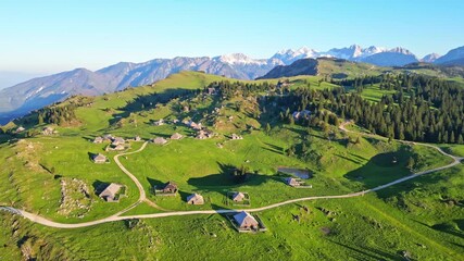 Aerial view of idyllic mountain landscape with traditional village and cabins, Velika Planina, Kamnik, Slovenia.